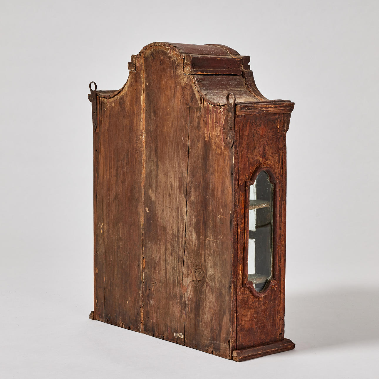 A late baroque hanging cabinet, 18th century, carved wood decor, original colour in brown red. Furniture - Cupboards, Cabinets & Shelves - Auctionet