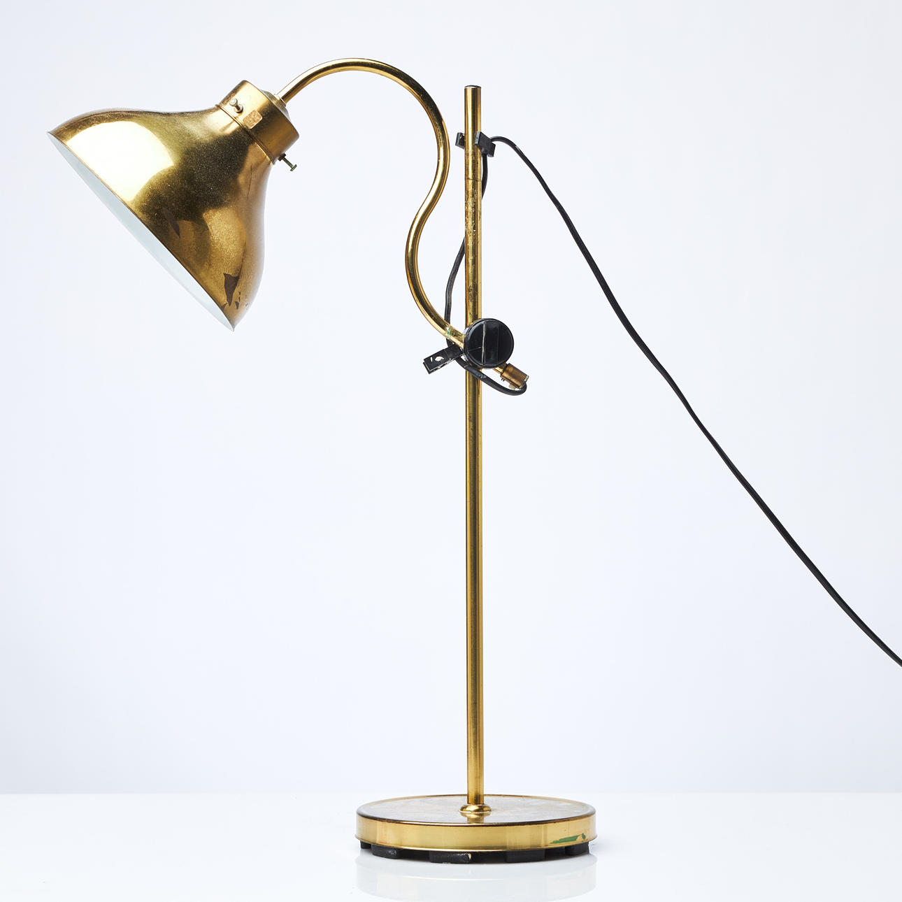 TABLE LAMP, yellow-foiled brass, adjustable, ABO marked on the bottom.