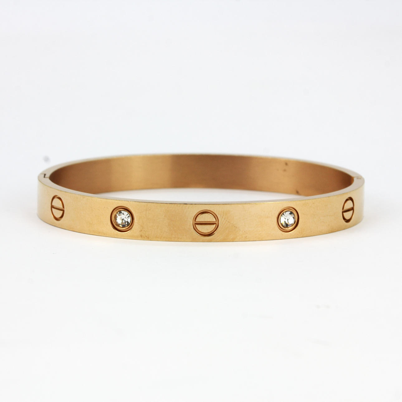 BRAZALETE ENGASTADO CON PIEDRAS DORADAS.