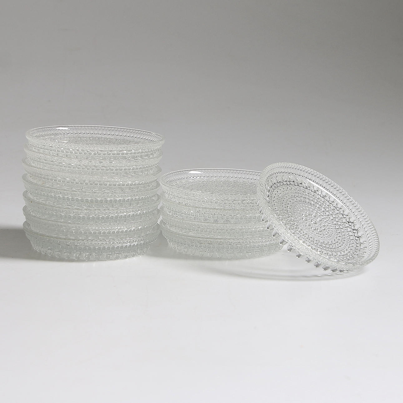 OIVA TOIKKA. Coasters, 12 st, glas, "Kastehelmi", Iittala, Finland.