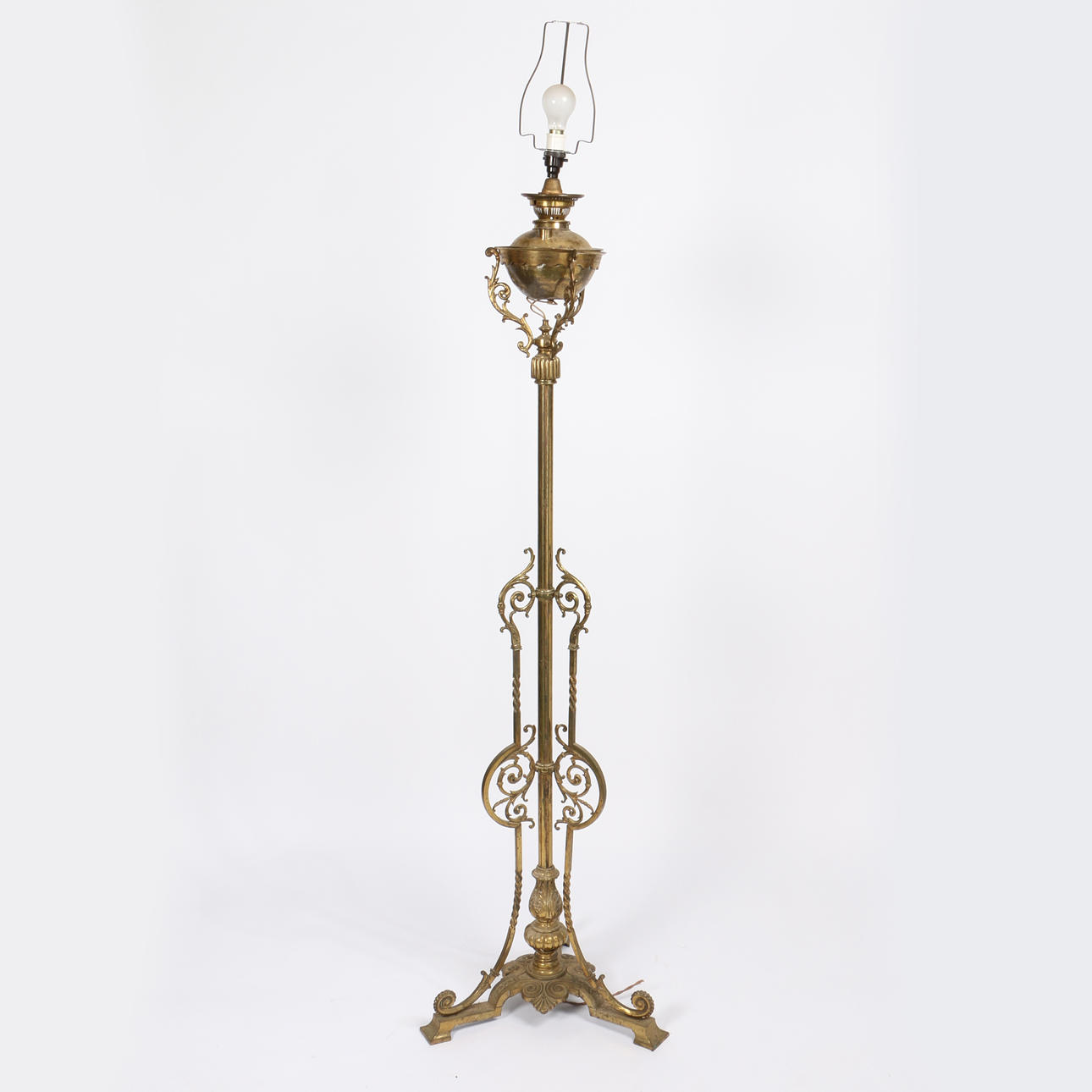 A LATE VICTORIAN BRASS STANDARD LAMP.