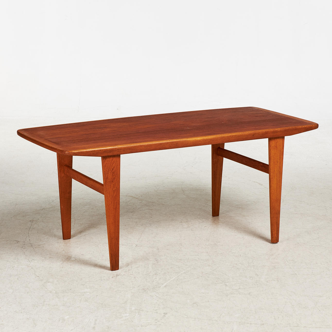 A 1950's coffee table, veneered with teak.