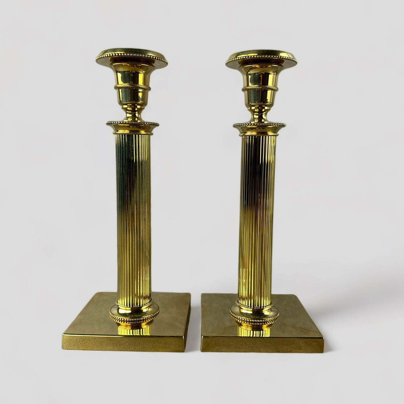 PEDER LAMM. A pair of “Gustaf” commemorative candlesticks, Gustavian style, brass, numbered, 172, 173, Skultuna.