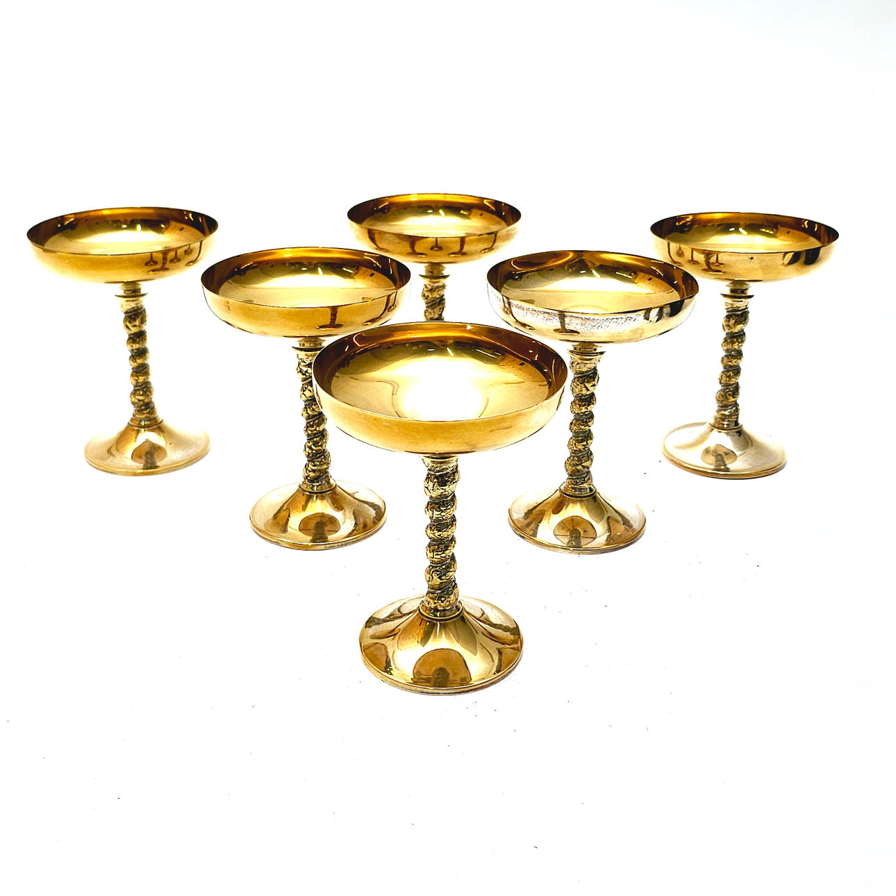 SEIS COPAS DE CHAMPAGNE EN ALPACA DORADA.