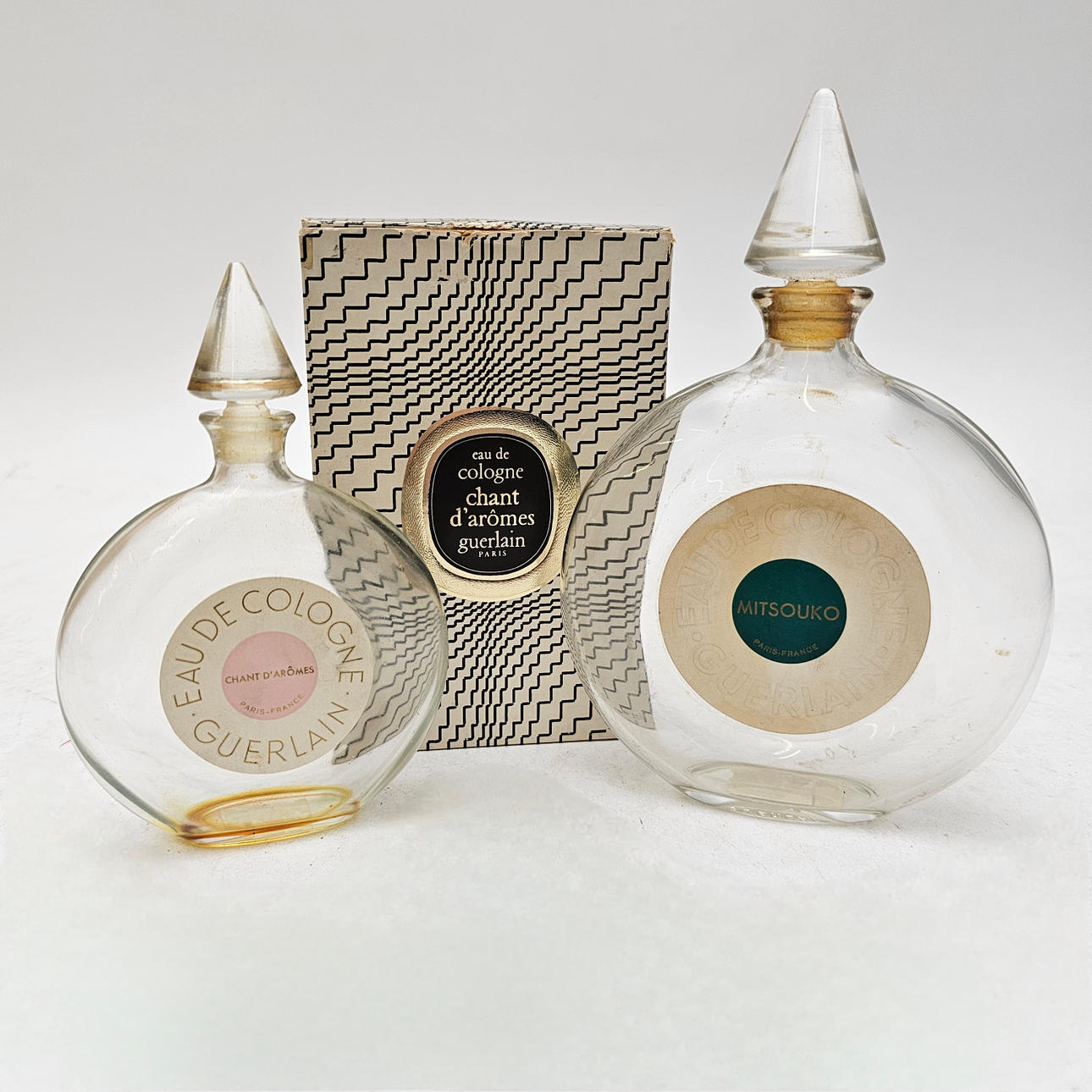 2 BOTTLES OF GUERLAIN, MITSOUKO AND CHANT D'AROMES PERFUME.