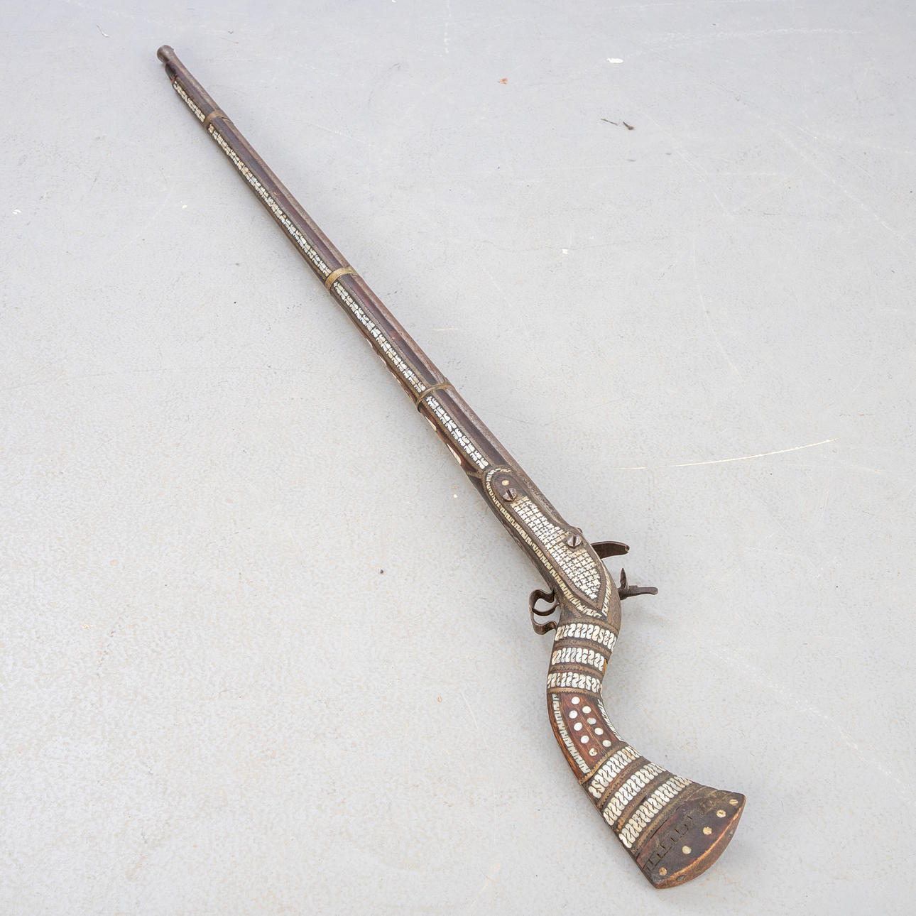Jezail long-armed flintlock rifle.