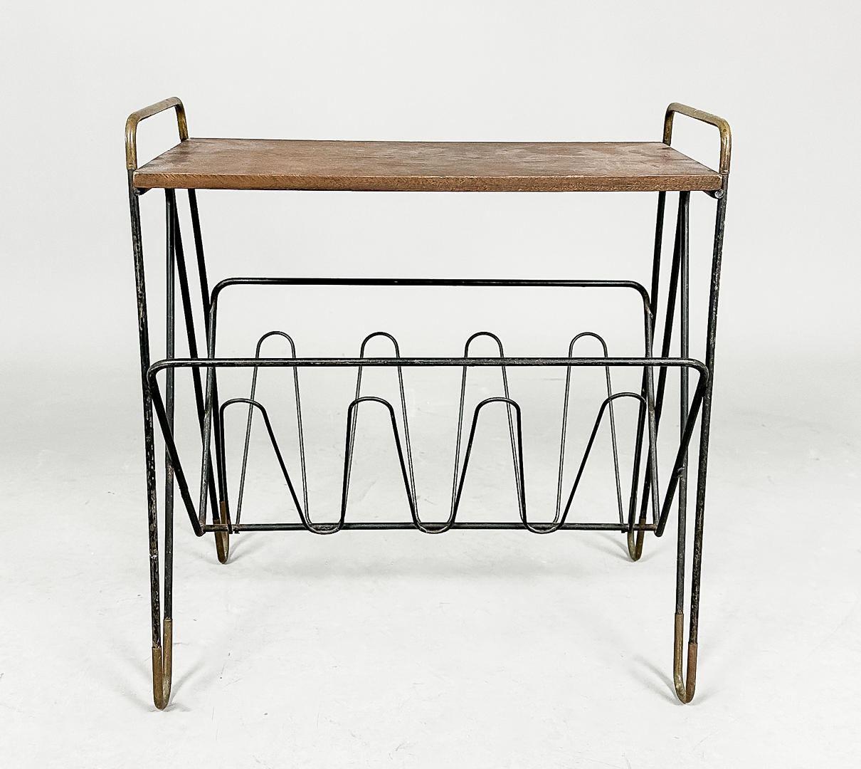 A teak magazine table with string undercarriage, 20th century.