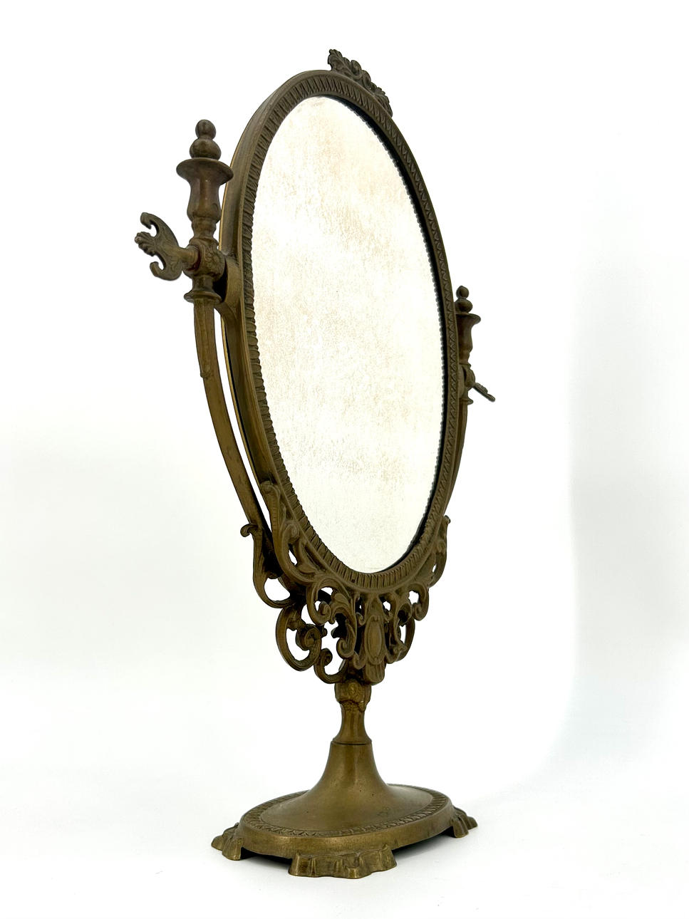 SMINKSPEGEL I MÄSSING MED LÄTT MARMORERING.