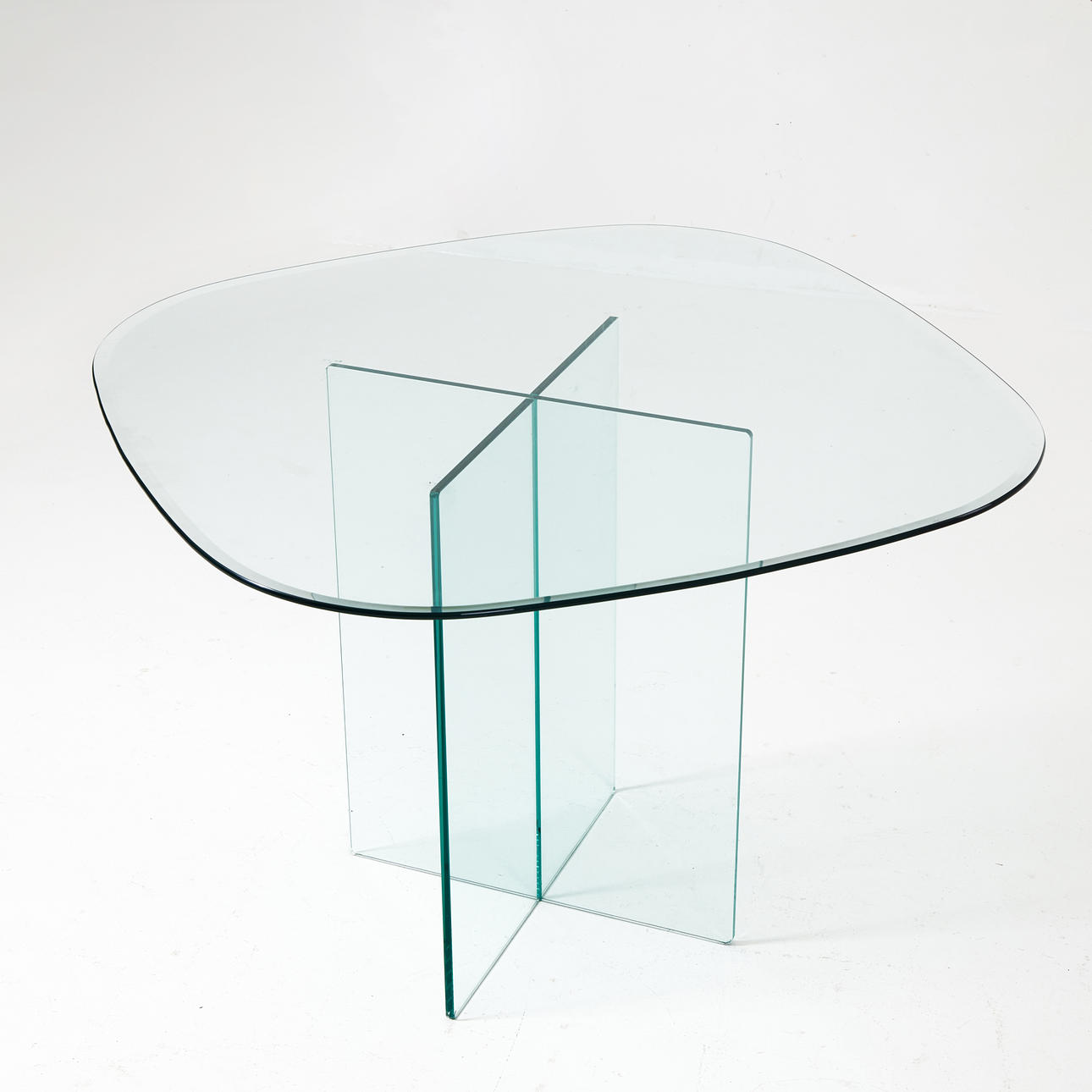 A glass dining table, 21st century.