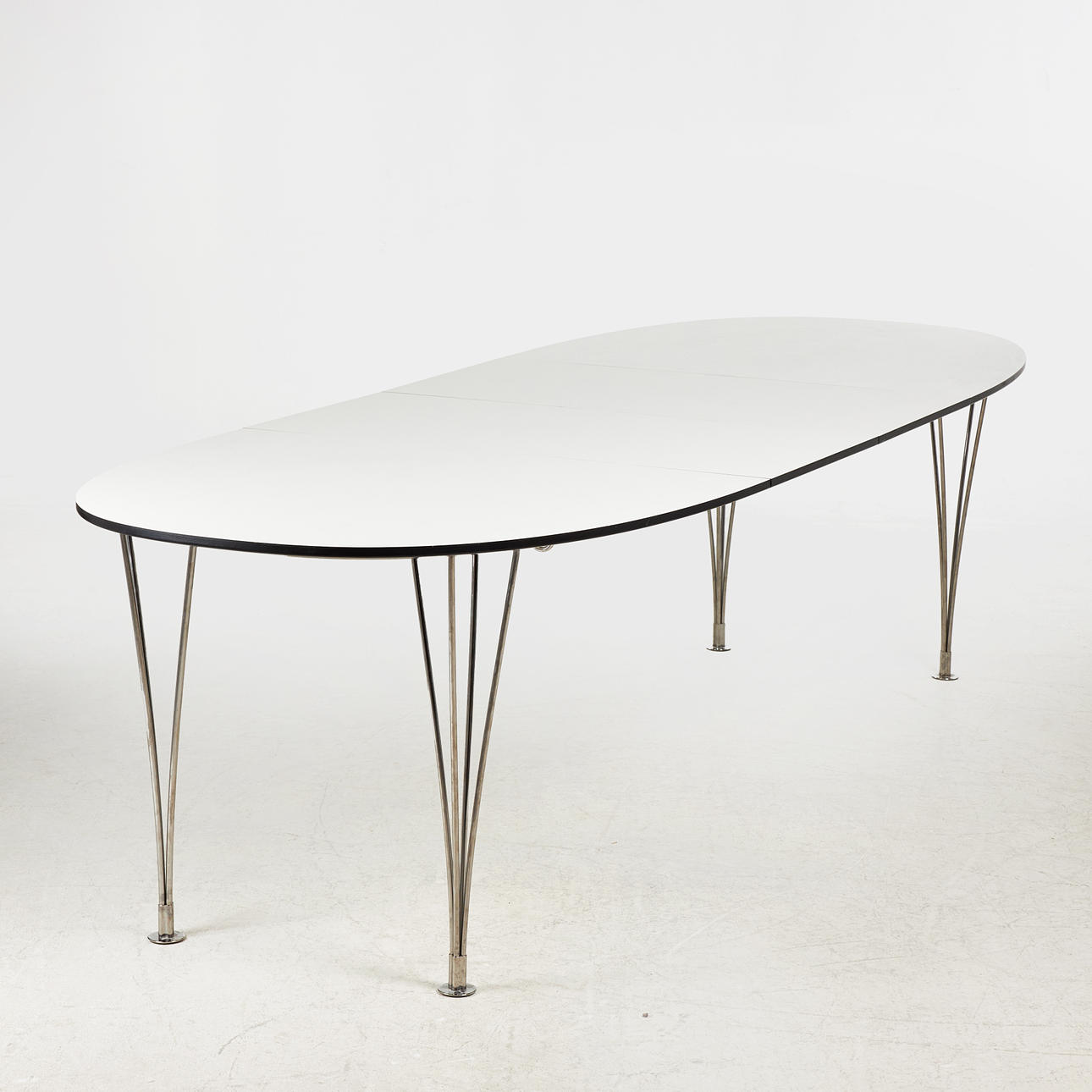 BRUNO MATHSSON & PIET HEIN. Dining table, “Superellips”, 2 sheets, laminate, chromed legs, Bruno Mathsson International, Värnamo, 2014, with label.