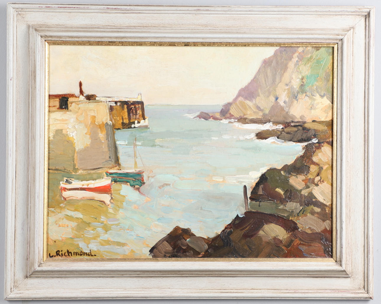 LEONARD RICHMOND (1889-1965). A CORNISH COVE BY A JETTY.
