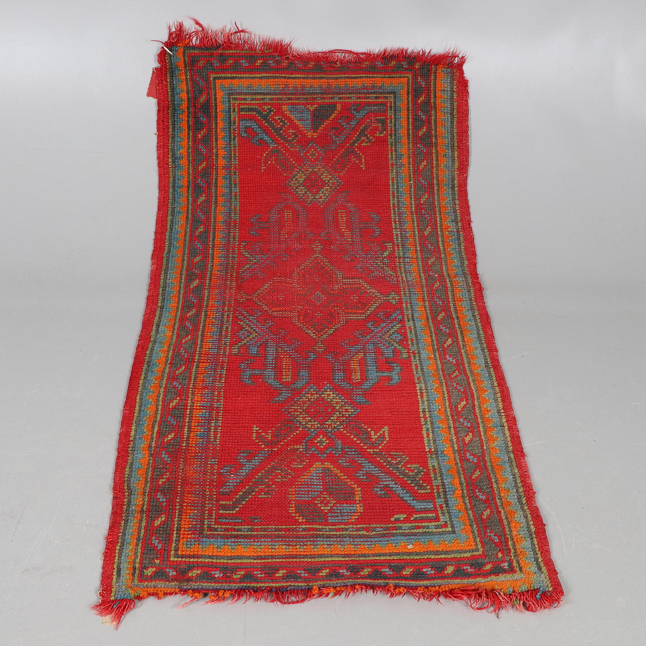 AN USHAK RUG.