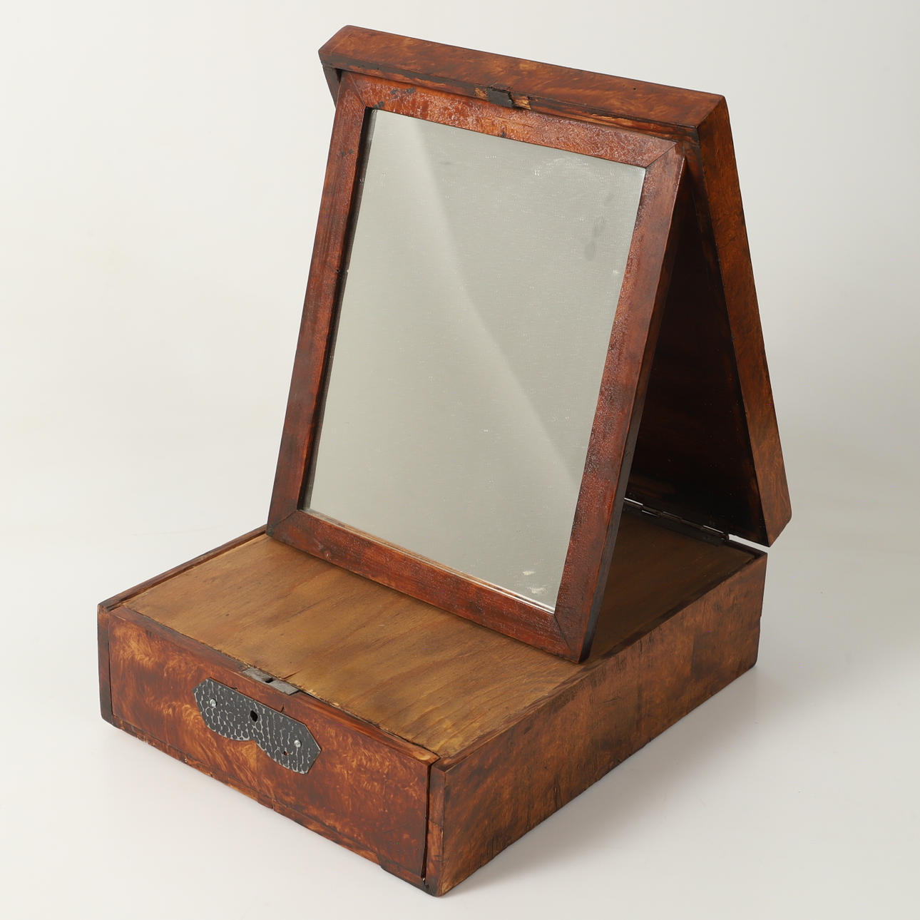 A 19th century birch shaving mirror.