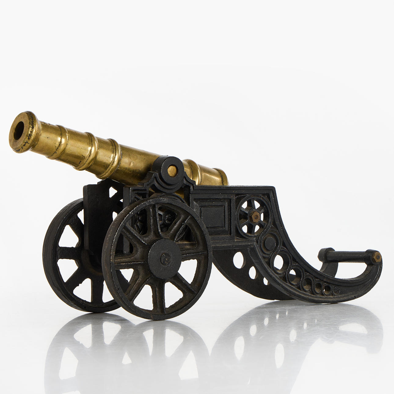TABLE CANNON, Brass on iron plate.