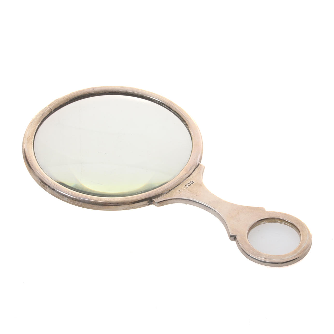 A GEORGE V SILVER MOUNTED MAGNIFYING GLASS.