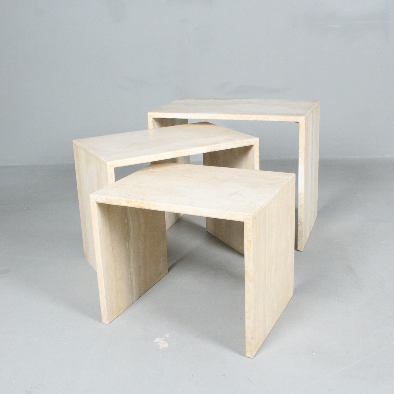 Three travertine side tables from the 1960s.