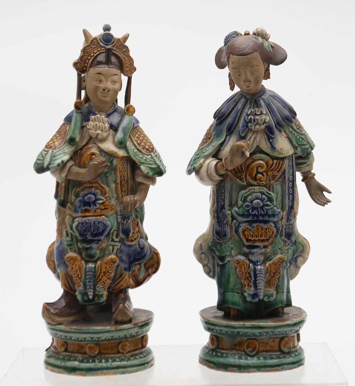 Two Chinese dignitaries in Ming-style glazed earthenware.