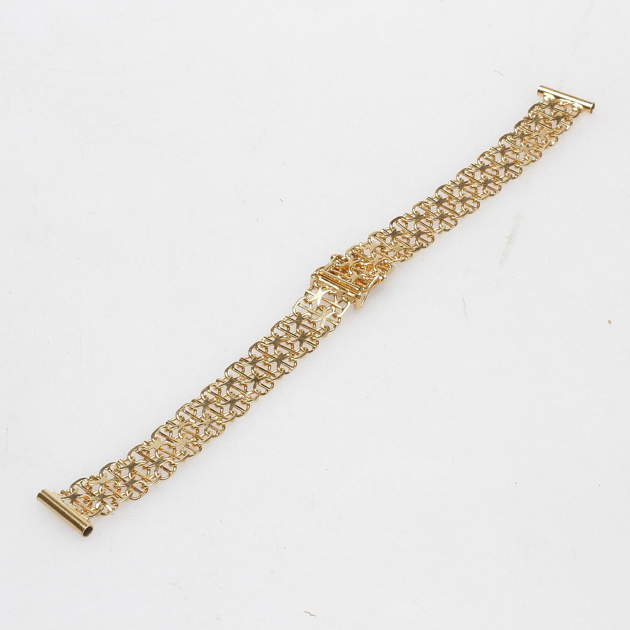 KLOCKARMBAND, "X-länk", 18k guld, vikt ca. 12,6 gram.