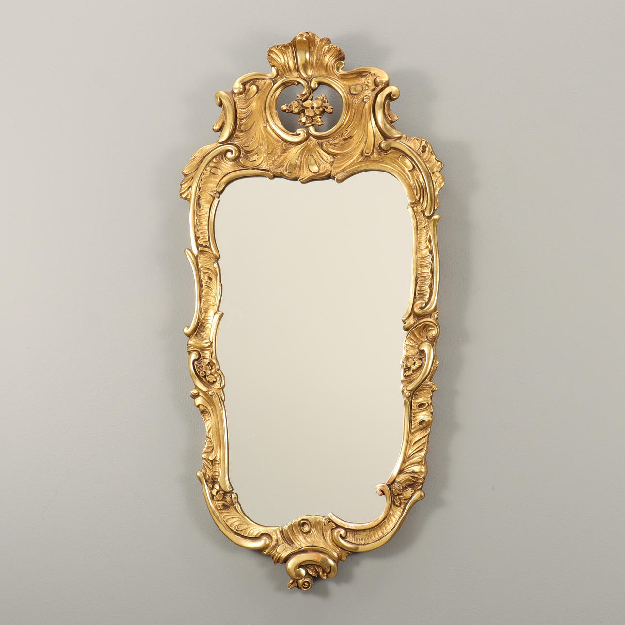 WALL MIRROR Rococo style, gilded, wooden frame.