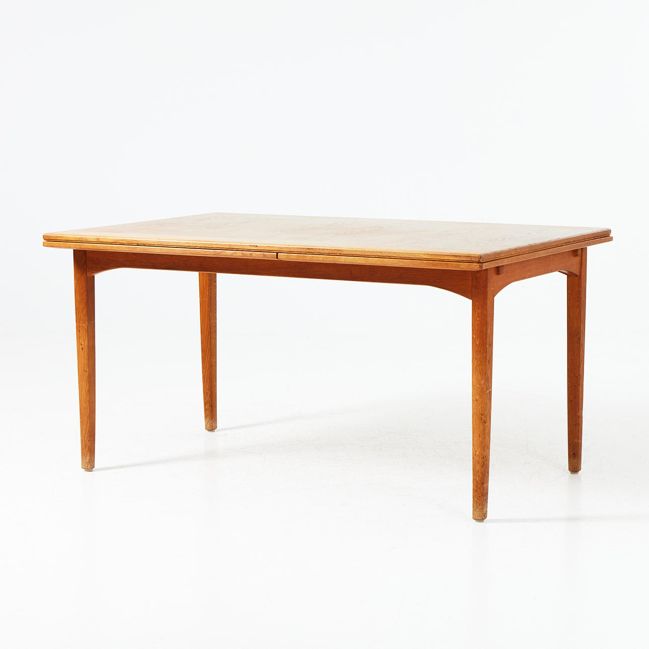 CARL MALMSTEN. dining table with pull-out plates, “Gustavus”, tray marked on the underside, mid 20th century.