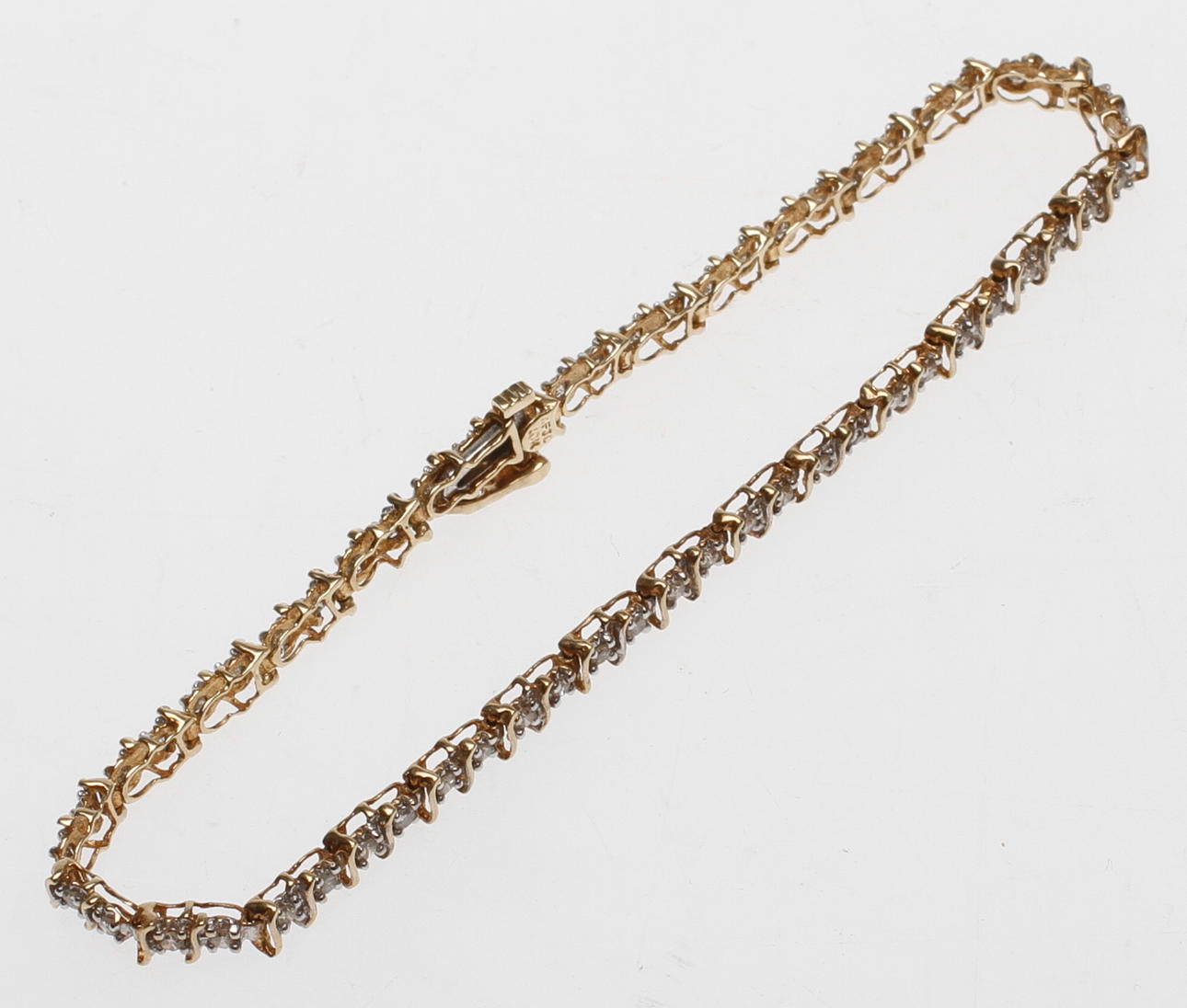 ARMBAND, 10k guld med vita stenar, vikt ca 5,7 gram.