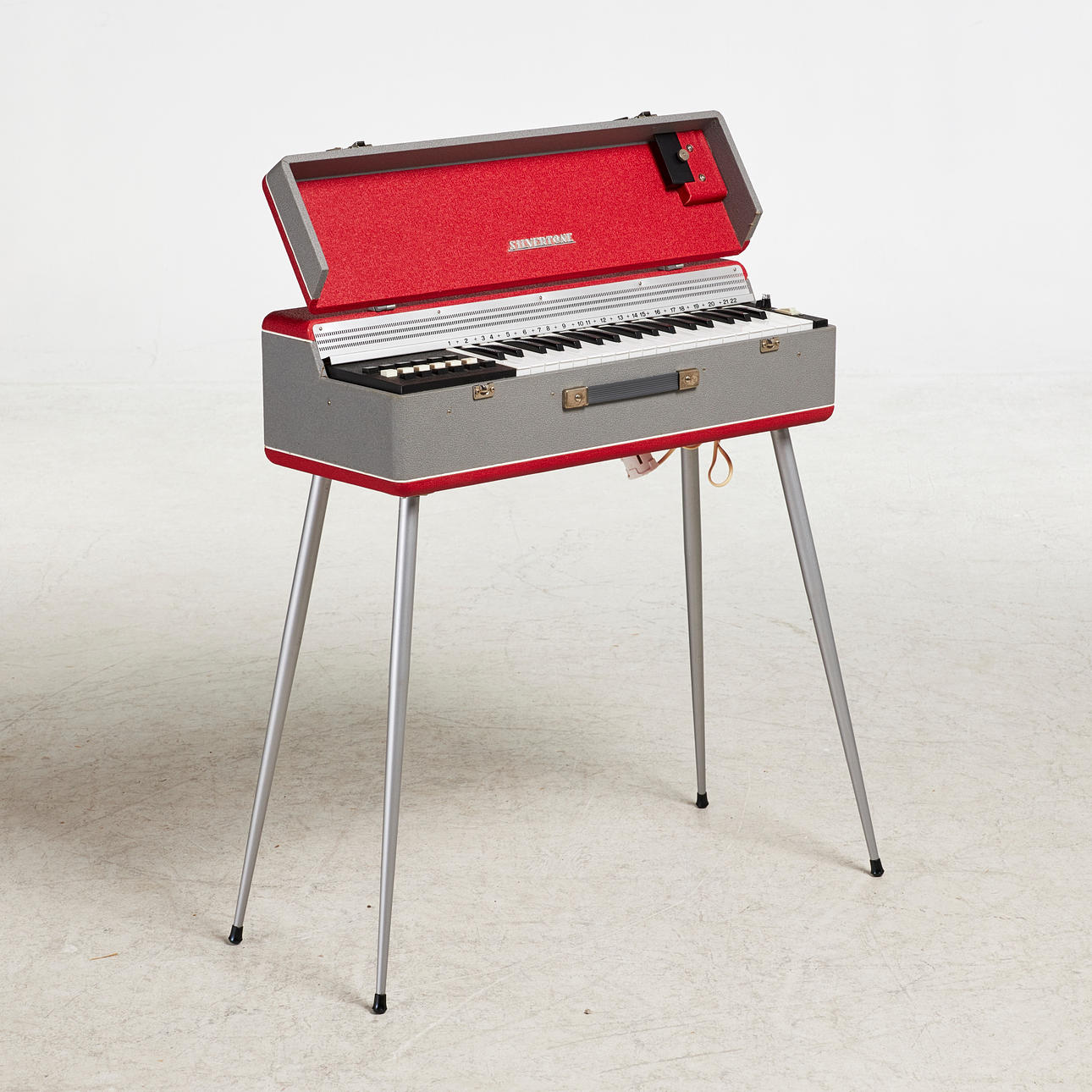 A 1960s Silvertone portable electric organ.