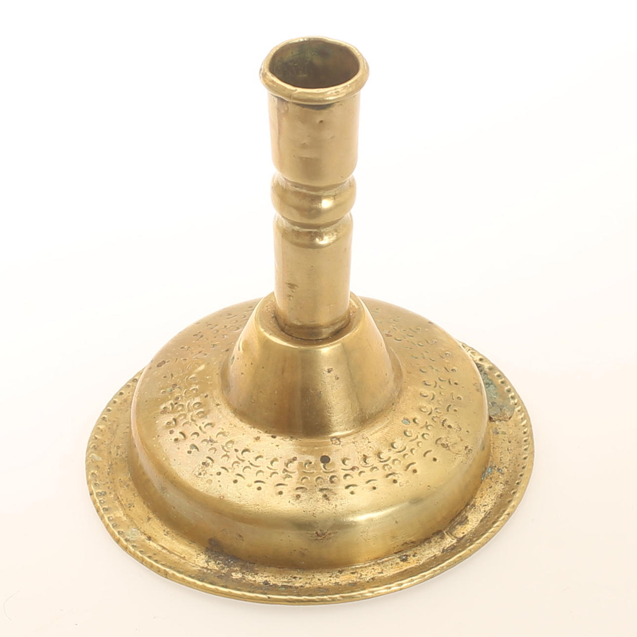 A brass candlestick, 18th century.