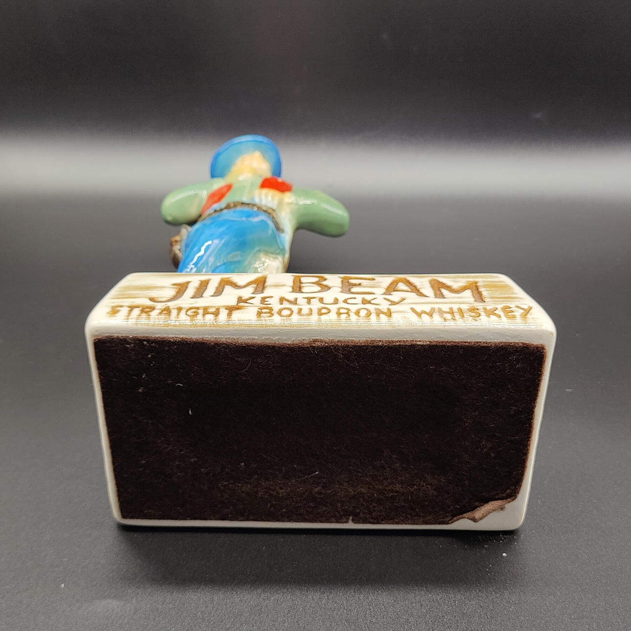 JIM BEAM CERAMIC ADVERTISING CHARACTER: COWBOY HOLDING A GLASS OF