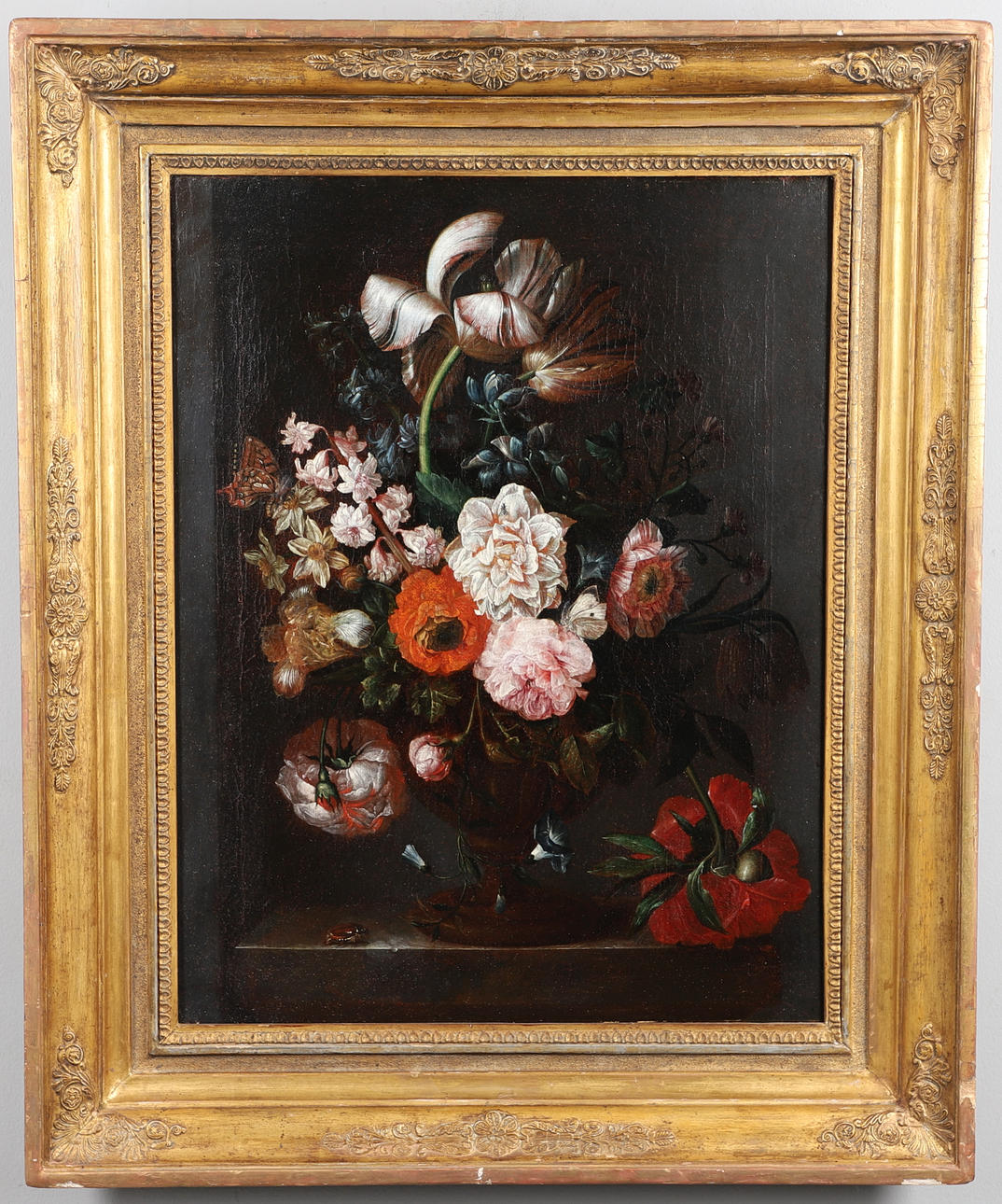 CIRCLE OF RACHEL RUYSCH (1664-1750). STILL LIFE OF MIXED FLOWERS IN A GLASS BOWL UPON A LEDGE, WITH A FLY, A BEETLE AND BUTTERFLIES.