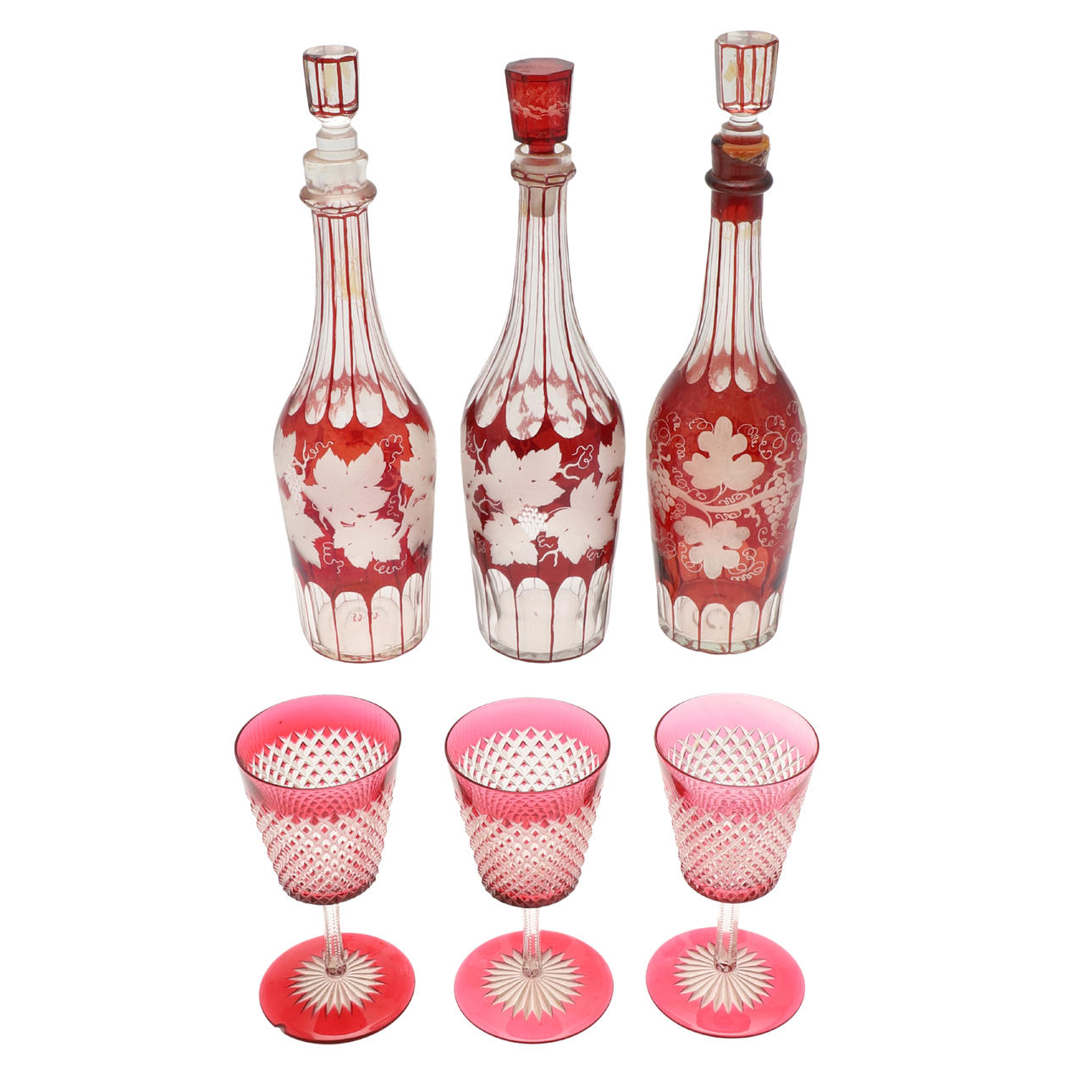 THREE 19TH CENTURY BOHEMIAN RUBY FLASHED DECANTERS.