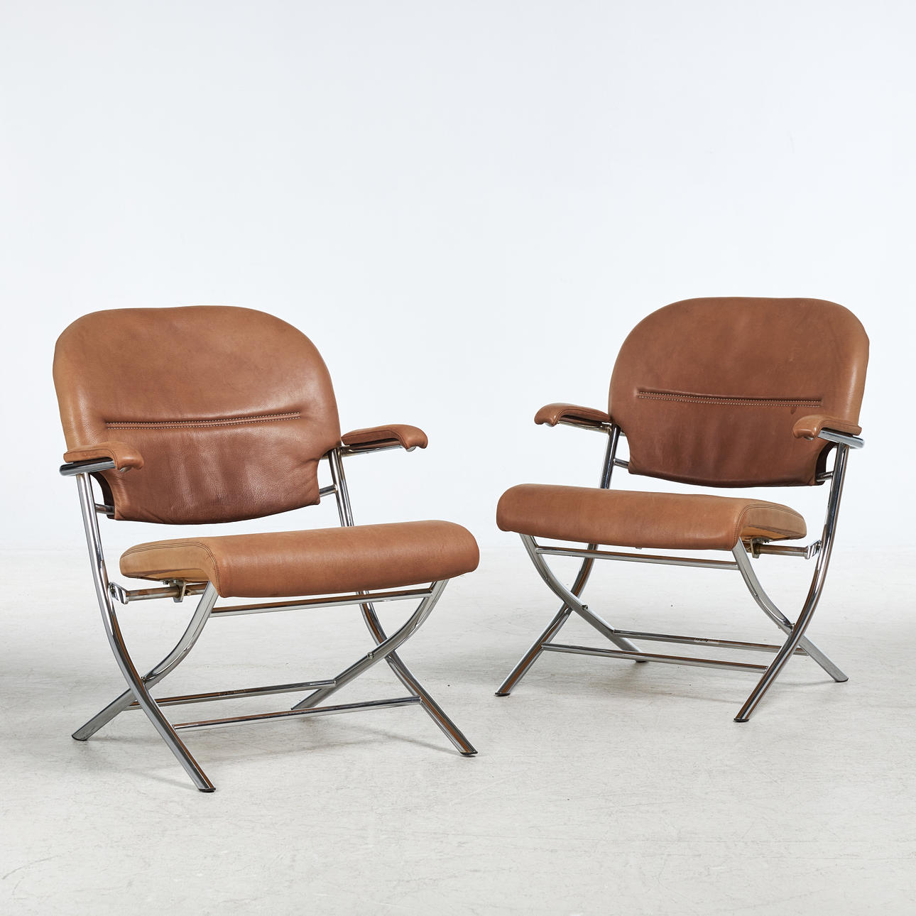 RAY REDEL. Armchairs, 1 pair, Dux, leather upholstered, chromed leg ...
