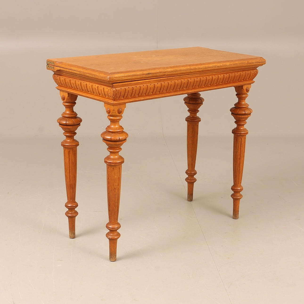 A Neo-Renaissance oak gaming table, 19th century.