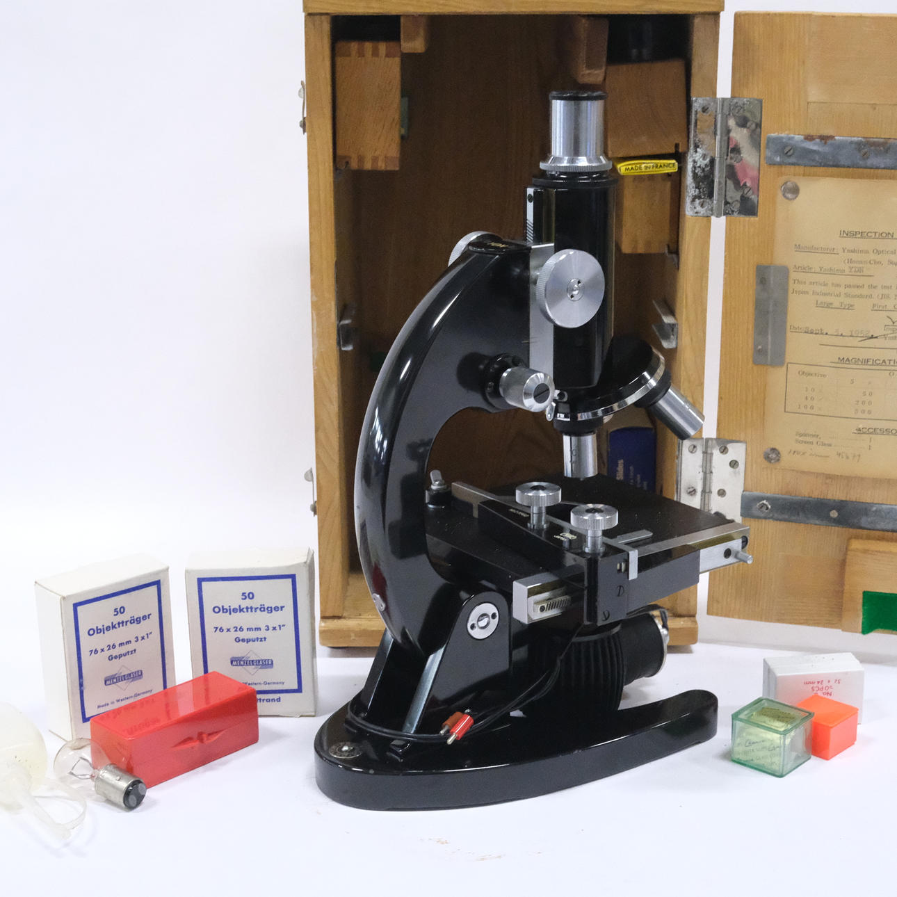 YASHIMA OPTICAL CO. MICROSCOPE WITH ACCESSORIES, JAPAN.