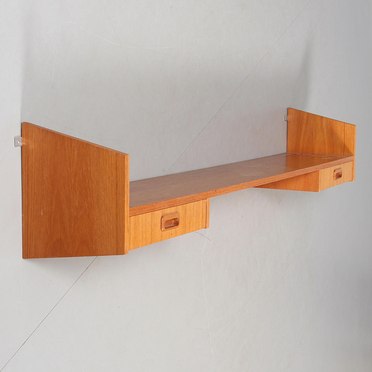 A teak wall shelf, mid 20th century.