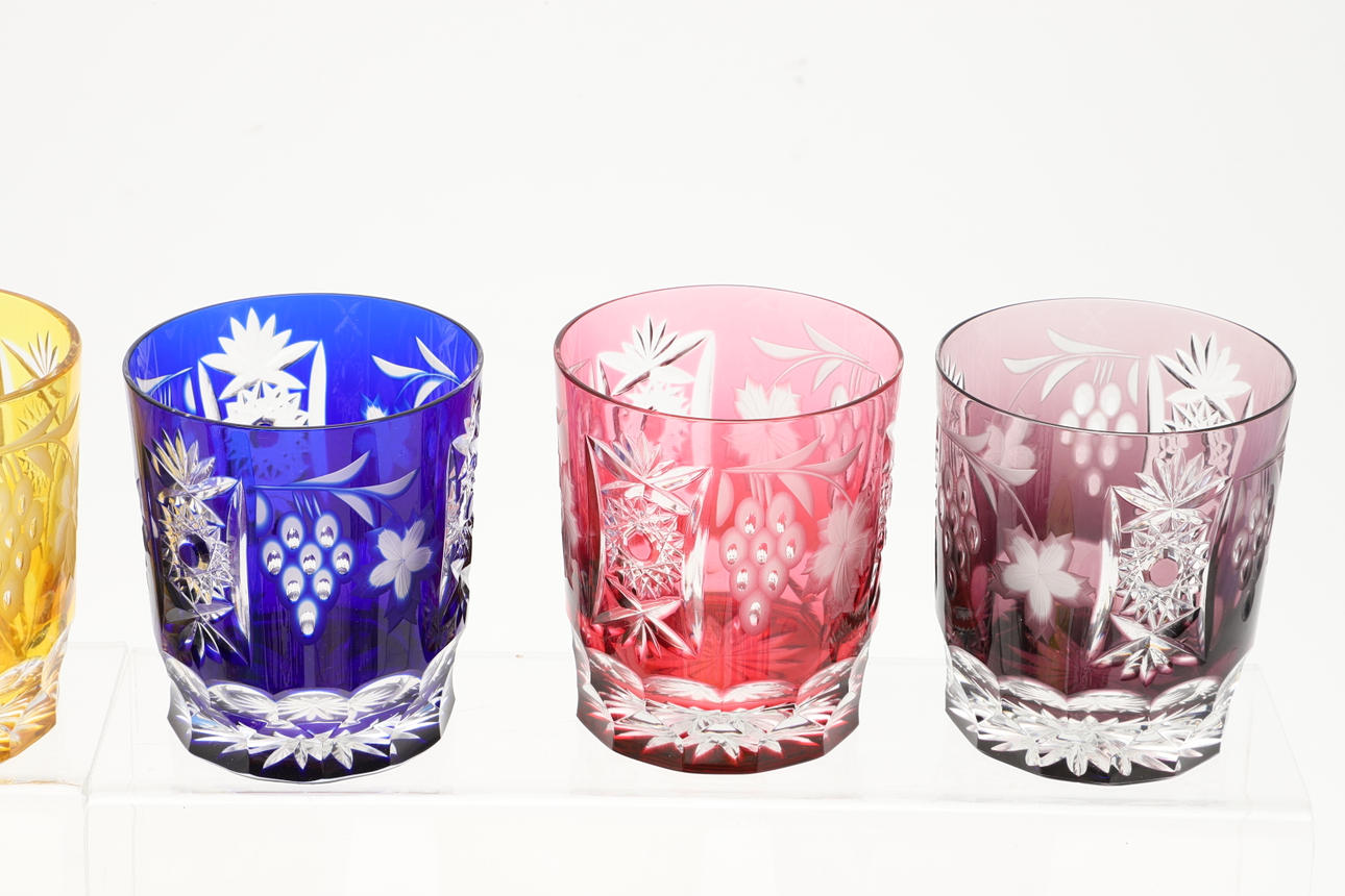 ELEVEN LARGE COLOURED CUT GLASS TUMBLERS. Glass Tableware