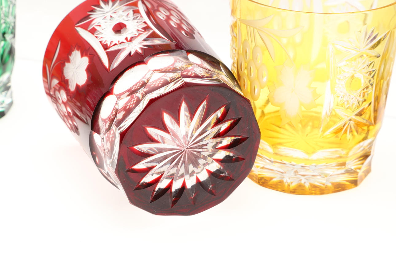 ELEVEN LARGE COLOURED CUT GLASS TUMBLERS. Glass Tableware