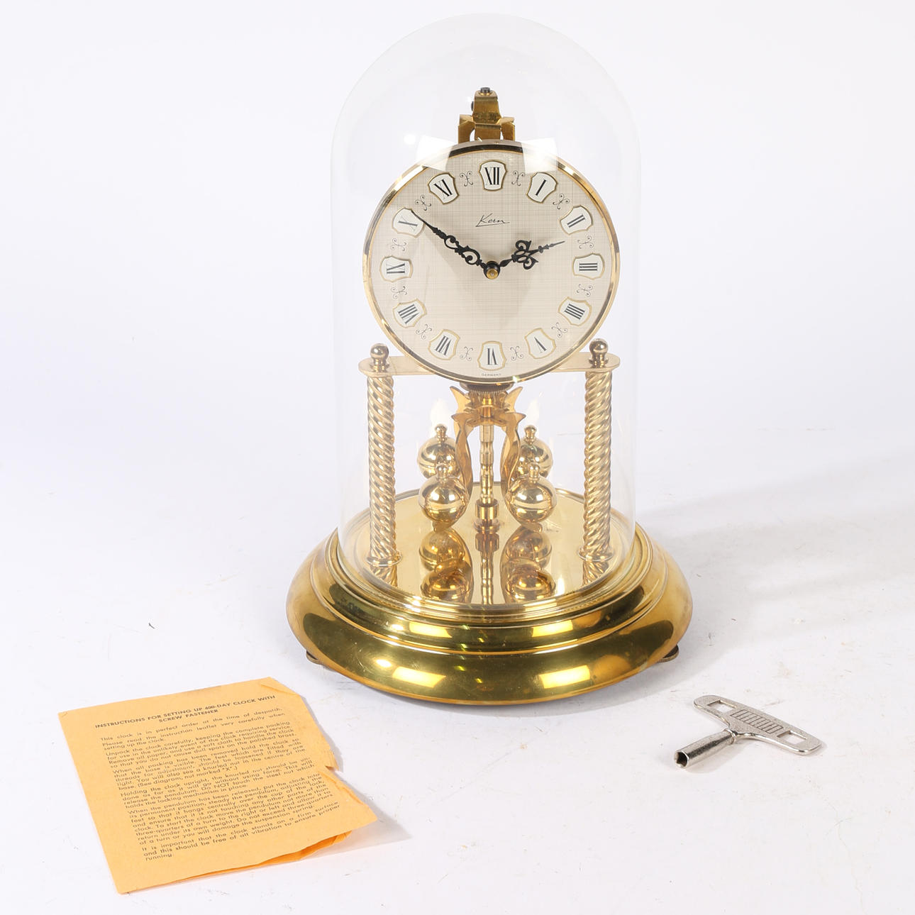 KERN ANNIVERSARY CLOCK WITH GLASS DOME.