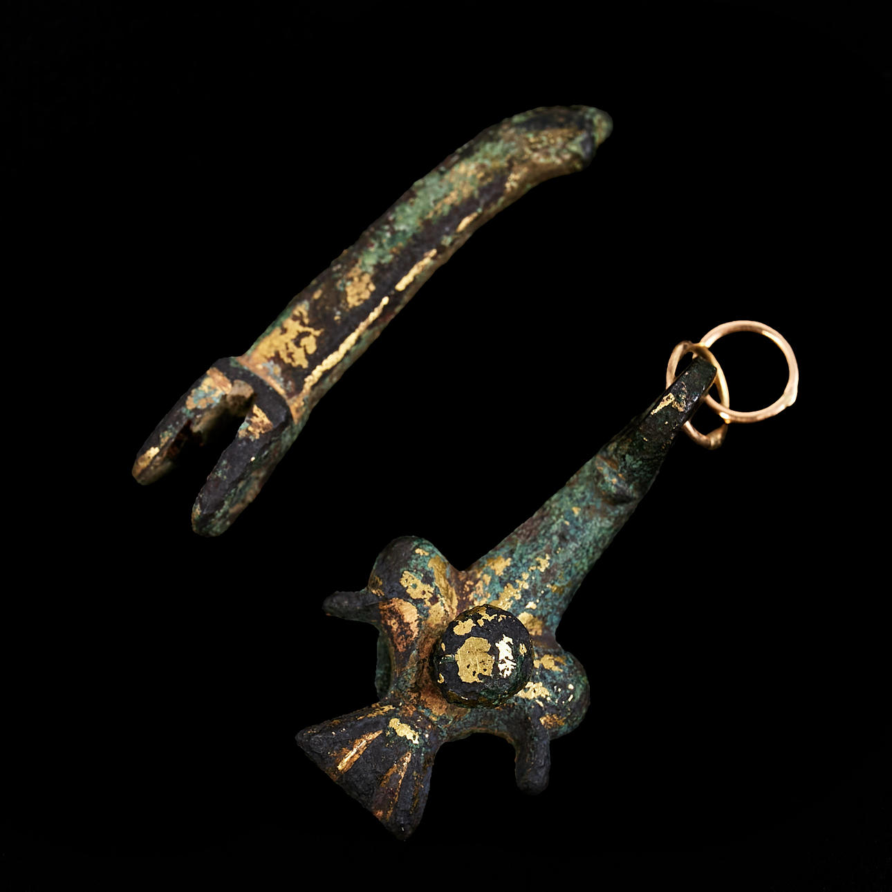Two bronze harnesk ornaments, 14th century.