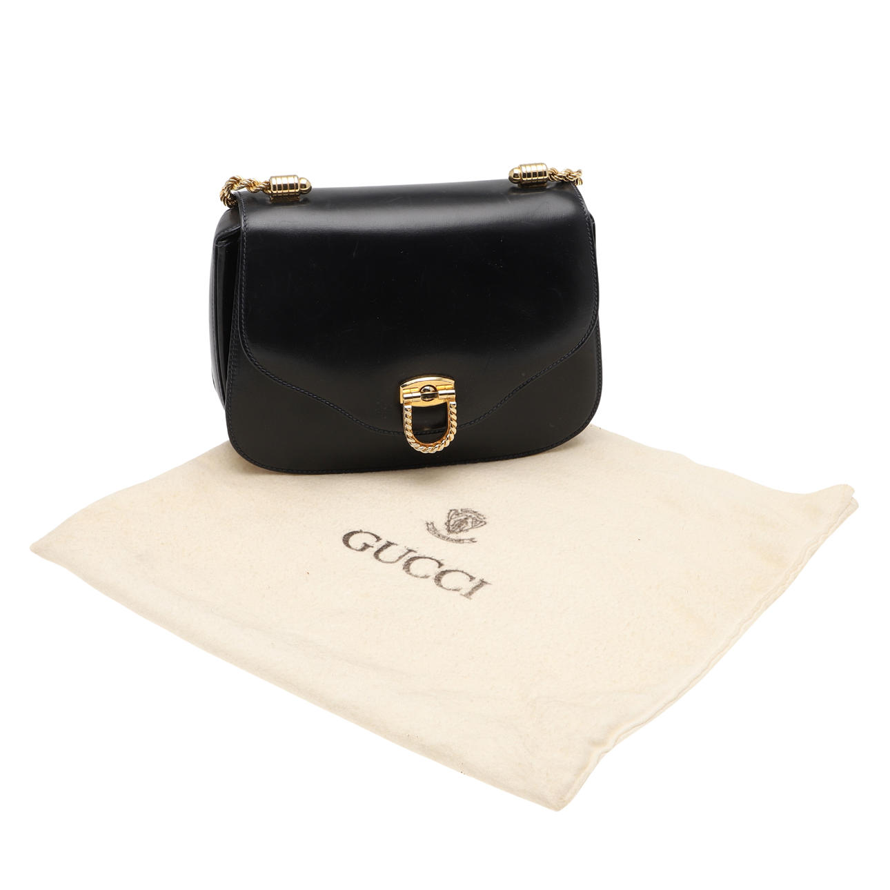 GUCCI- A VINTAGE BLACK LEATHER HANDBAG.