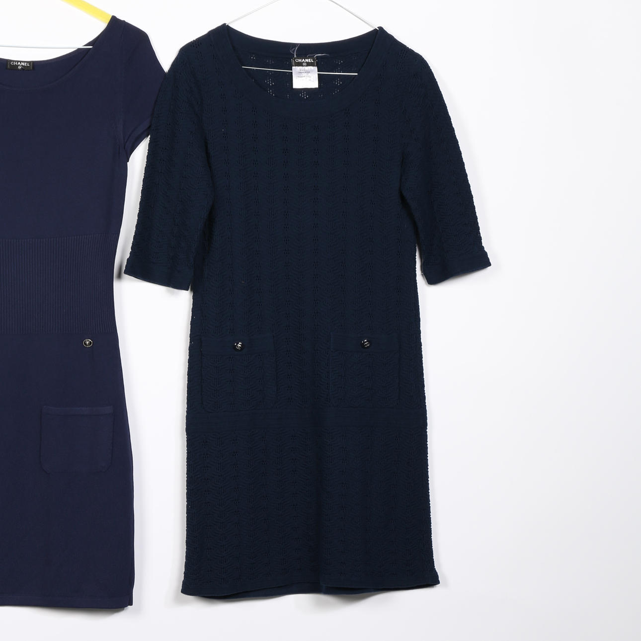 TWO NAVY BLUE CHANEL DRESSES.