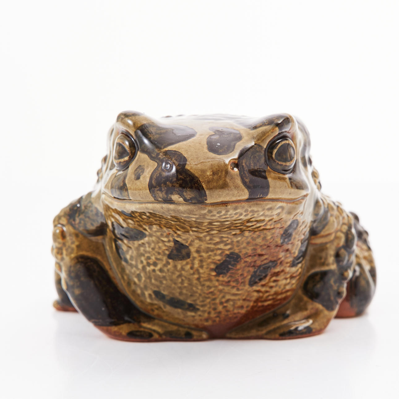 PAUL HOFF. Green spotted toad, stoneware, for WWF.