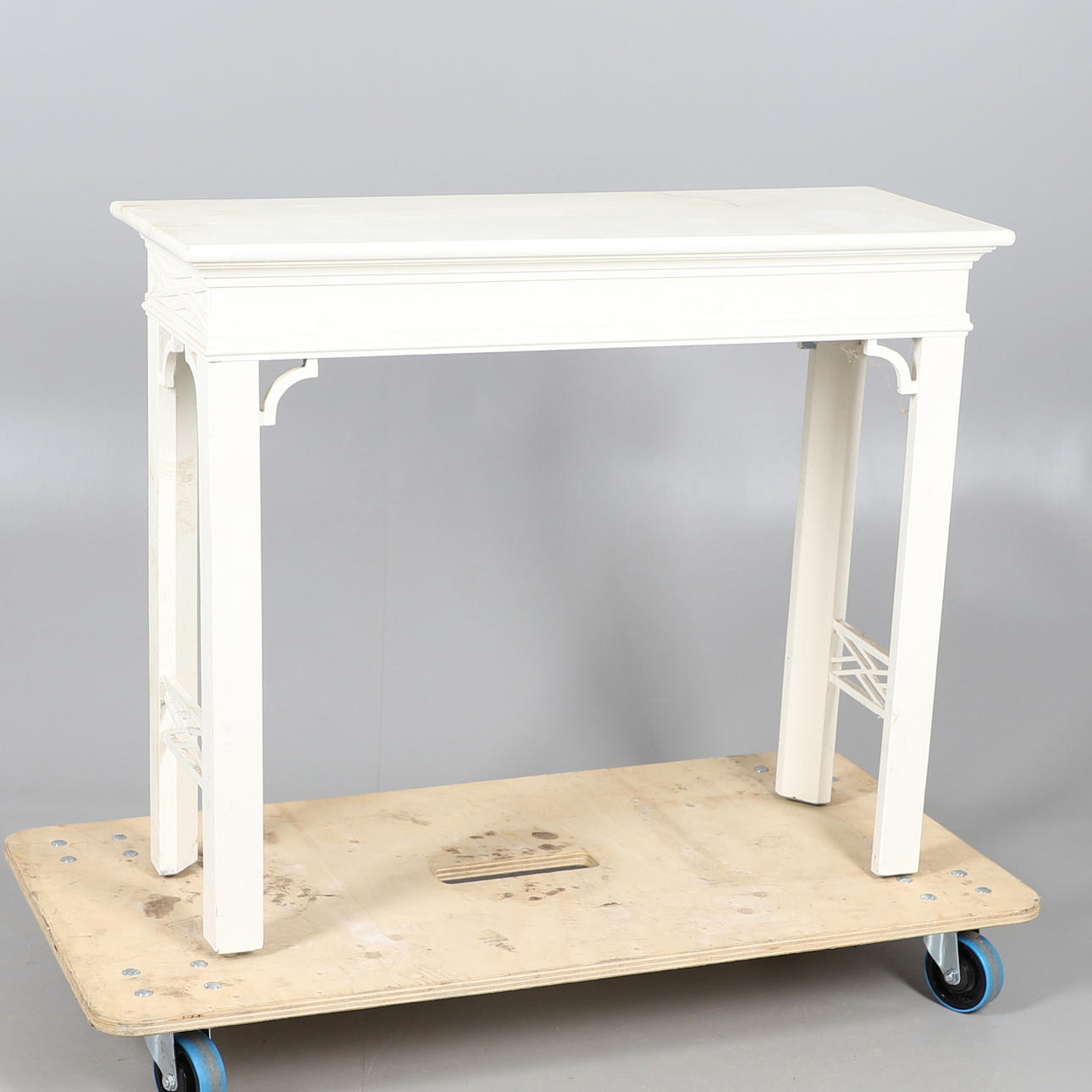 A MODERN WHITE PAINTED HALL TABLE.