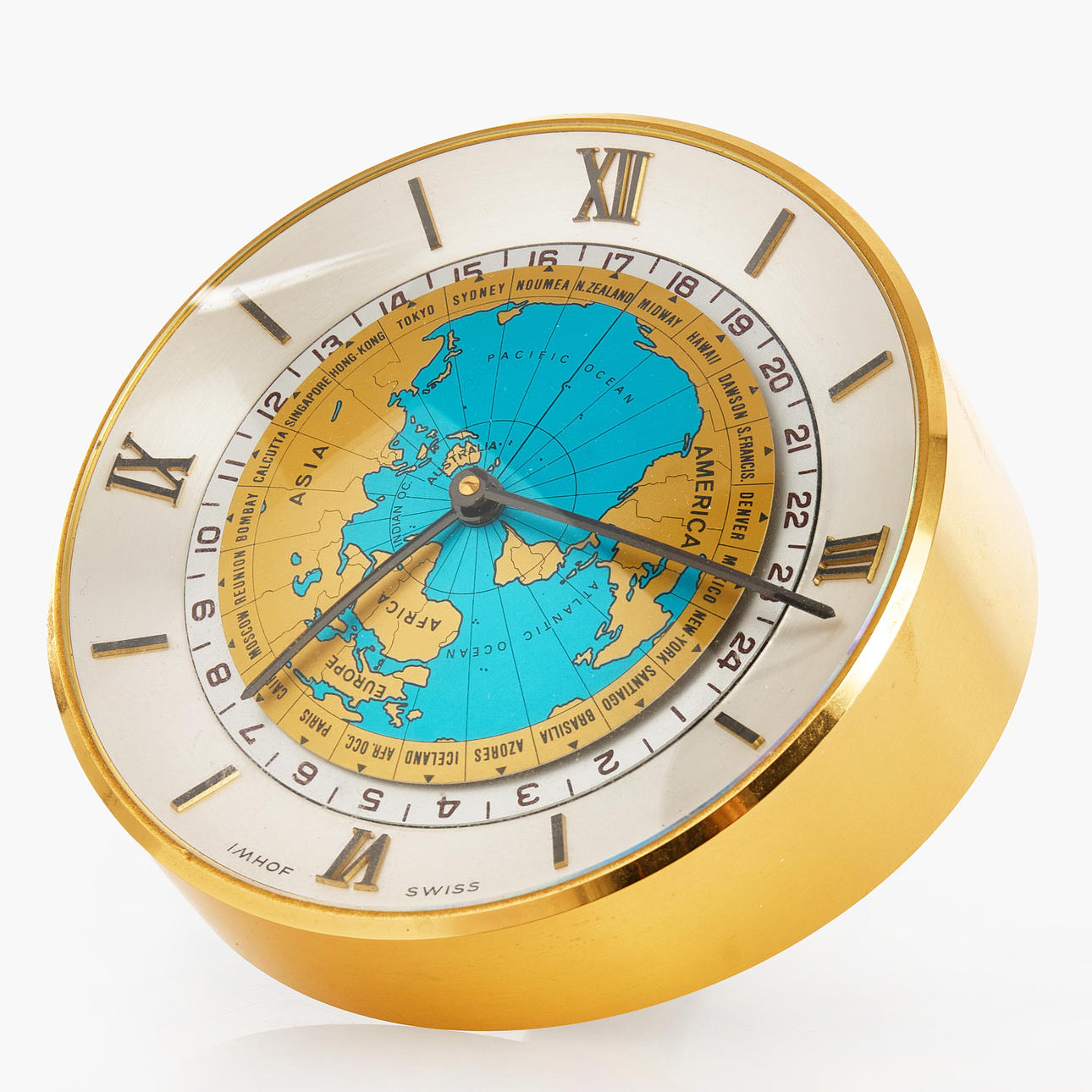 IMHOF, table clock, “World time clock”, brass, dial with rotating world map, Switzerland.