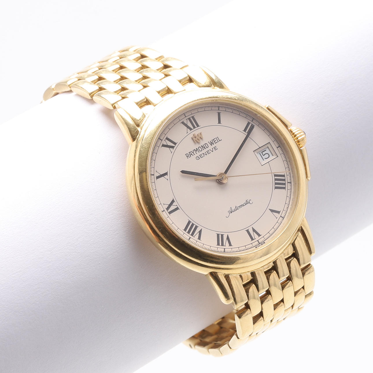 A wristwatch, 18k gold. Raymond Weil, date, Automatic.