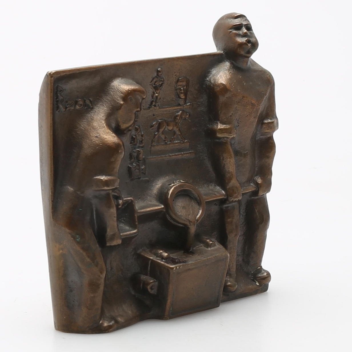 OIDENTIFIERAD KONSTNÄR. Verkstadsmiljö. Skulptur, brons för Calmeks i Svedala. Bär signatur i gjutningen.