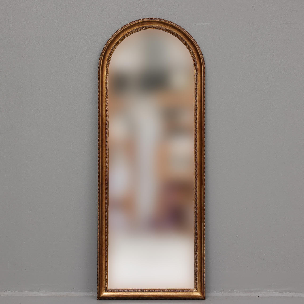 A wooden mirror, 20th century.
