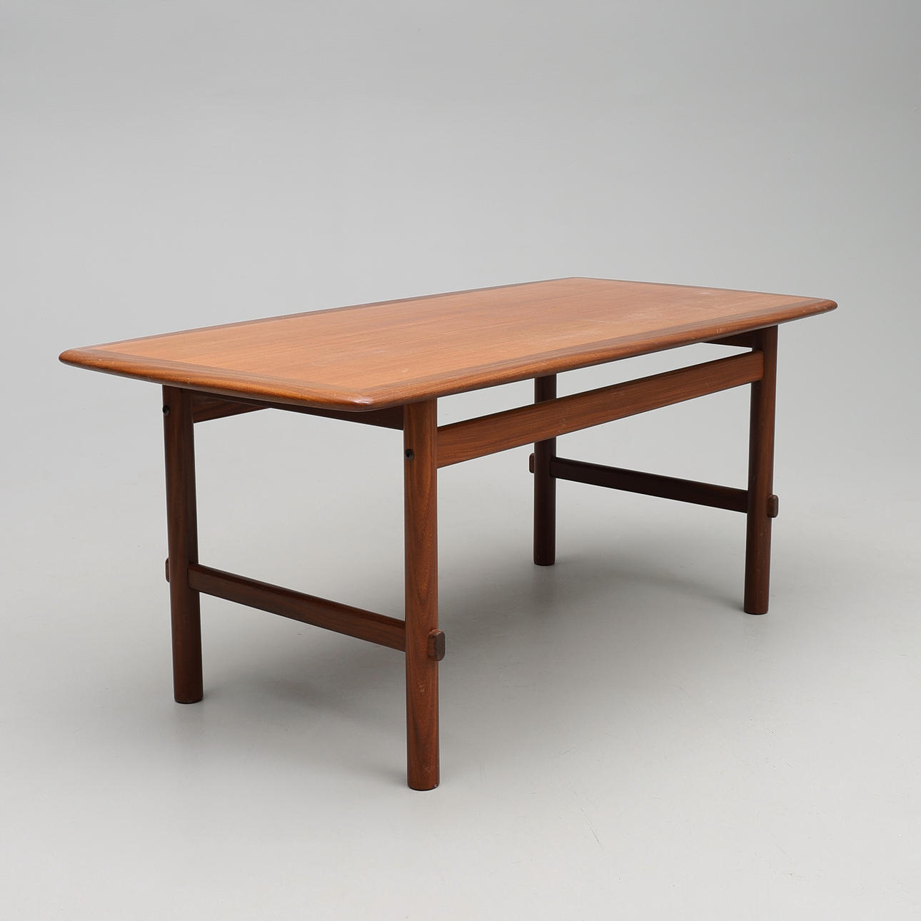 A 1960's teak/walnut coffee table.