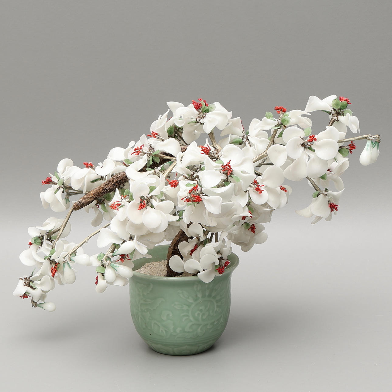 A 20th-century porcelain bonsai tree.