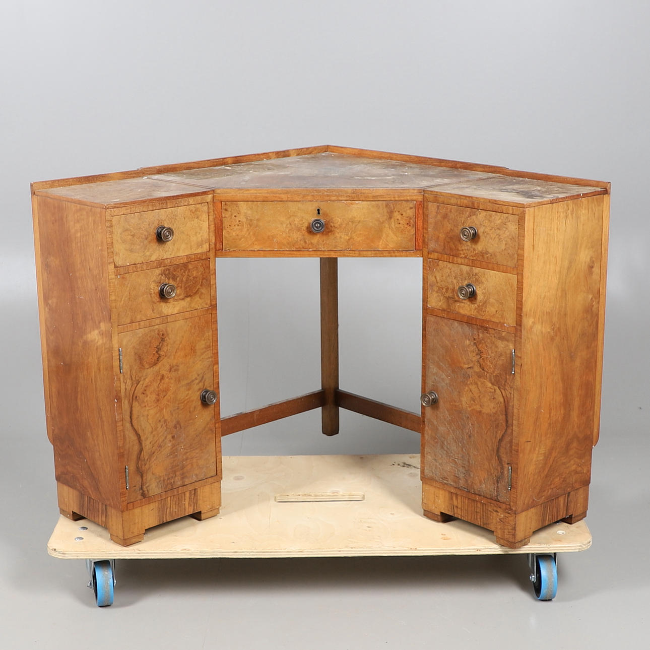 A HEALS WALNUT CORNER DESK.