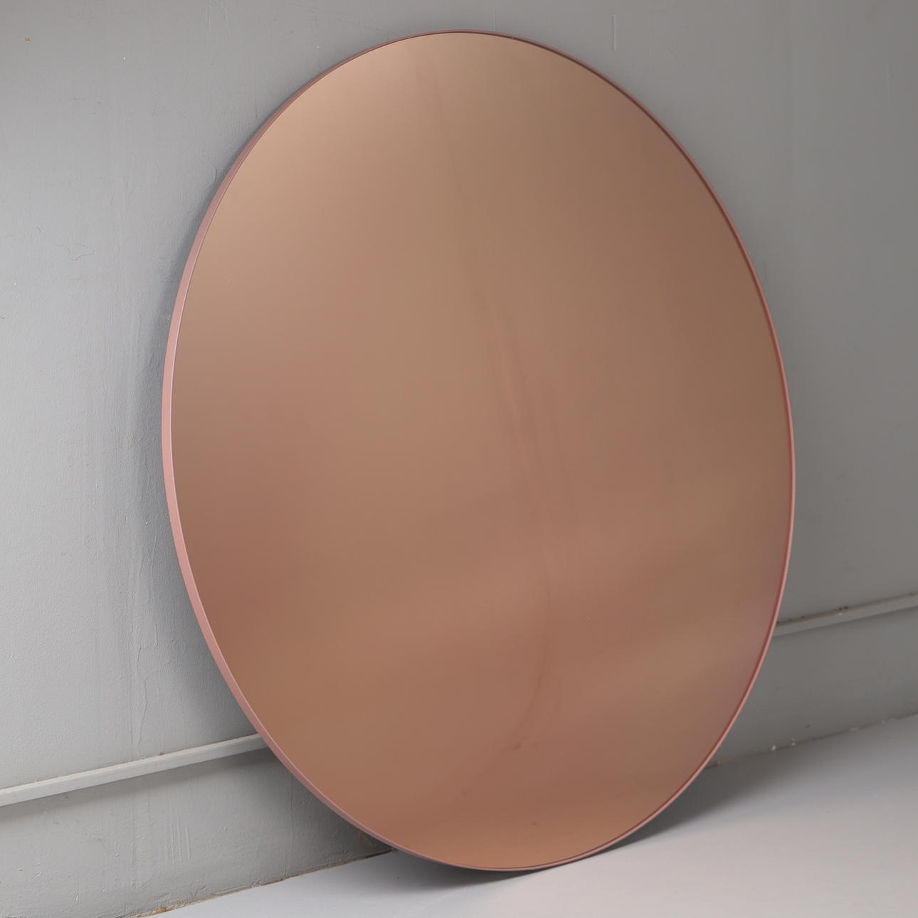 A round 'Circum' mirror, 21st century.